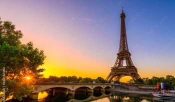 View of Eiffel Tower and river Seine at sunrise in Paris, France. Eiffel Tower is one of the most iconic landmarks of Paris